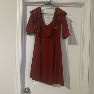 Cute off the shoulder burnt orange dress .